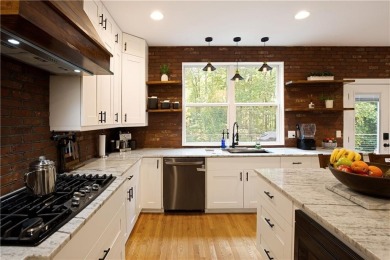 Price to move, this custom-built home sits on a roundabout on Hampton Golf Village in Georgia - for sale on GolfHomes.com, golf home, golf lot