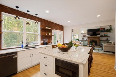 Price to move, this custom-built home sits on a roundabout on Hampton Golf Village in Georgia - for sale on GolfHomes.com, golf home, golf lot