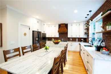 Price to move, this custom-built home sits on a roundabout on Hampton Golf Village in Georgia - for sale on GolfHomes.com, golf home, golf lot