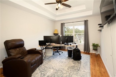Price to move, this custom-built home sits on a roundabout on Hampton Golf Village in Georgia - for sale on GolfHomes.com, golf home, golf lot