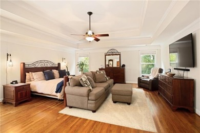 Price to move, this custom-built home sits on a roundabout on Hampton Golf Village in Georgia - for sale on GolfHomes.com, golf home, golf lot