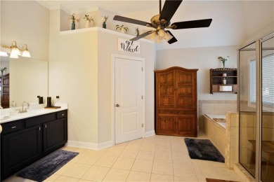 Price to move, this custom-built home sits on a roundabout on Hampton Golf Village in Georgia - for sale on GolfHomes.com, golf home, golf lot