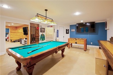 Price to move, this custom-built home sits on a roundabout on Hampton Golf Village in Georgia - for sale on GolfHomes.com, golf home, golf lot