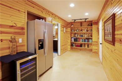 Price to move, this custom-built home sits on a roundabout on Hampton Golf Village in Georgia - for sale on GolfHomes.com, golf home, golf lot