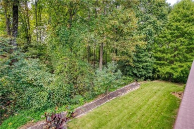 Price to move, this custom-built home sits on a roundabout on Hampton Golf Village in Georgia - for sale on GolfHomes.com, golf home, golf lot