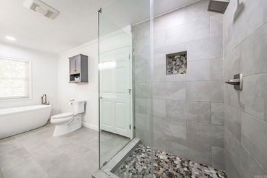 Tucked into a serene, park-like setting, this beautifully on Mountain Ranch Golf Club in Arkansas - for sale on GolfHomes.com, golf home, golf lot