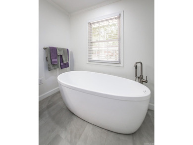 Tucked into a serene, park-like setting, this beautifully on Mountain Ranch Golf Club in Arkansas - for sale on GolfHomes.com, golf home, golf lot