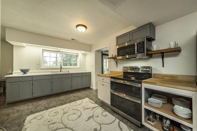 Tucked into a serene, park-like setting, this beautifully on Mountain Ranch Golf Club in Arkansas - for sale on GolfHomes.com, golf home, golf lot