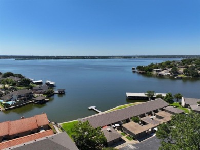 IT'S ALL ABOUT THE VIEW! This well-appointed waterfront condo is on De Cordova Bend Country Club in Texas - for sale on GolfHomes.com, golf home, golf lot