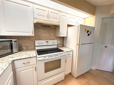 IMPECCABLE UNIT IN THE HEART OF PEMBROKE PINES, RESORT STYLE!! on Flamingo Lakes Country Club in Florida - for sale on GolfHomes.com, golf home, golf lot