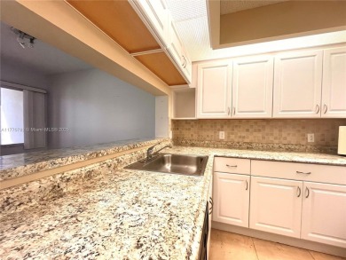 IMPECCABLE UNIT IN THE HEART OF PEMBROKE PINES, RESORT STYLE!! on Flamingo Lakes Country Club in Florida - for sale on GolfHomes.com, golf home, golf lot