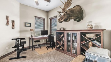 Set high above the 9th hole in Redlands Mesa, 324 Iron Horse Ct on The Golf Club At Redlands Mesa in Colorado - for sale on GolfHomes.com, golf home, golf lot