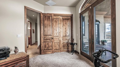 Set high above the 9th hole in Redlands Mesa, 324 Iron Horse Ct on The Golf Club At Redlands Mesa in Colorado - for sale on GolfHomes.com, golf home, golf lot