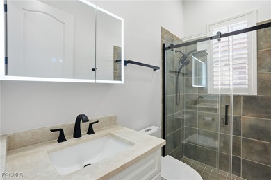 Welcome to luxury living in the prestigious Shadow Wood Preserve on Shadow Wood Preserve in Florida - for sale on GolfHomes.com, golf home, golf lot