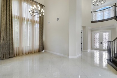 Beautiful home with a waterfront and golf course view! This home on Jupiter Country Club in Florida - for sale on GolfHomes.com, golf home, golf lot