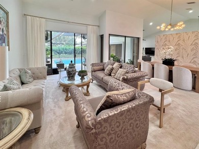 Hurry and take a look at this tropical, spacious pool home in La on Woodmont Country Club in Florida - for sale on GolfHomes.com, golf home, golf lot