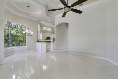 Beautiful home with a waterfront and golf course view! This home on Jupiter Country Club in Florida - for sale on GolfHomes.com, golf home, golf lot