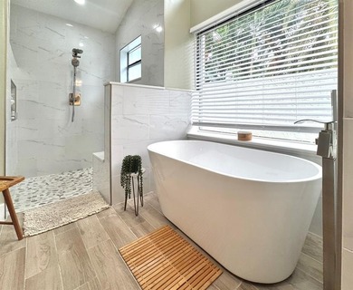 Hurry and take a look at this tropical, spacious pool home in La on Woodmont Country Club in Florida - for sale on GolfHomes.com, golf home, golf lot