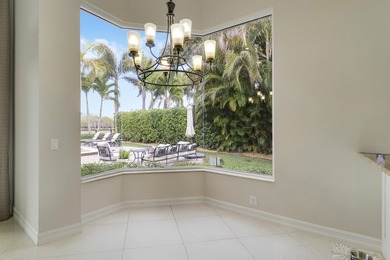 Beautiful home with a waterfront and golf course view! This home on Jupiter Country Club in Florida - for sale on GolfHomes.com, golf home, golf lot