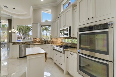 Beautiful home with a waterfront and golf course view! This home on Jupiter Country Club in Florida - for sale on GolfHomes.com, golf home, golf lot