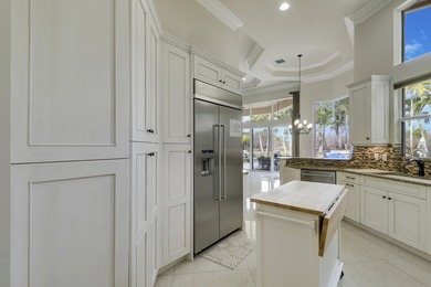 Beautiful home with a waterfront and golf course view! This home on Jupiter Country Club in Florida - for sale on GolfHomes.com, golf home, golf lot