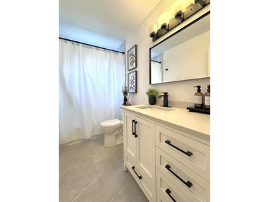 Hurry and take a look at this tropical, spacious pool home in La on Woodmont Country Club in Florida - for sale on GolfHomes.com, golf home, golf lot