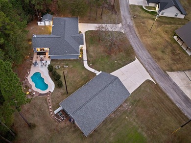 Discover your lakeside gem, a charming 3-bed, 2-bath home on on Rayburn Country Club in Texas - for sale on GolfHomes.com, golf home, golf lot