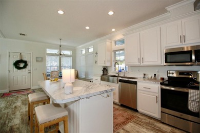 **GOLDEN GATE'S TAJ MAHAL** Magnificent 2 bedroom, 2 full bath on Mainlands Golf Club in Florida - for sale on GolfHomes.com, golf home, golf lot