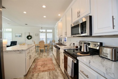 **GOLDEN GATE'S TAJ MAHAL** Magnificent 2 bedroom, 2 full bath on Mainlands Golf Club in Florida - for sale on GolfHomes.com, golf home, golf lot