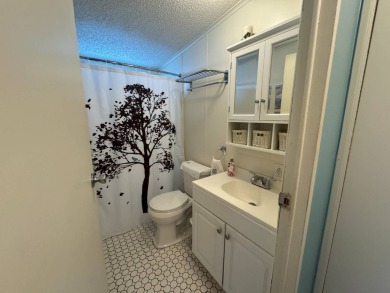 Look no further than this fully renovated, well-maintained 2b/2b on Lake Henry Golf Club in Florida - for sale on GolfHomes.com, golf home, golf lot
