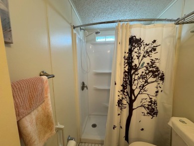 Look no further than this fully renovated, well-maintained 2b/2b on Lake Henry Golf Club in Florida - for sale on GolfHomes.com, golf home, golf lot
