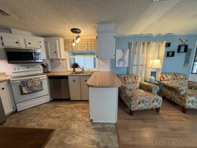 Look no further than this fully renovated, well-maintained 2b/2b on Lake Henry Golf Club in Florida - for sale on GolfHomes.com, golf home, golf lot