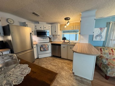 Look no further than this fully renovated, well-maintained 2b/2b on Lake Henry Golf Club in Florida - for sale on GolfHomes.com, golf home, golf lot