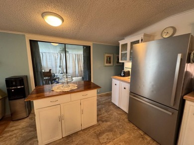Look no further than this fully renovated, well-maintained 2b/2b on Lake Henry Golf Club in Florida - for sale on GolfHomes.com, golf home, golf lot