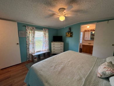 Look no further than this fully renovated, well-maintained 2b/2b on Lake Henry Golf Club in Florida - for sale on GolfHomes.com, golf home, golf lot