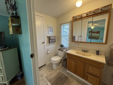 Look no further than this fully renovated, well-maintained 2b/2b on Lake Henry Golf Club in Florida - for sale on GolfHomes.com, golf home, golf lot