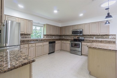 MOVE RIGHT IN and enjoy this 55+ guard-gated community of Tampa on Tampa Bay Golf and Country Club in Florida - for sale on GolfHomes.com, golf home, golf lot
