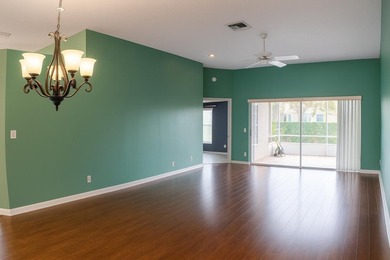 Welcome home to this vibrant 55+ 3BR/2.5BA villa with a garage on The Links At Boynton Beach - The Family Course in Florida - for sale on GolfHomes.com, golf home, golf lot