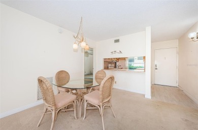 Tranquil views from this 2-bedroom 2-bathroom condo which is on Isla Del Sol Yacht and Country Club in Florida - for sale on GolfHomes.com, golf home, golf lot