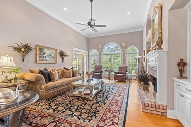 This exquisite four-sided blush brick estate is the epitome of on Royal Lakes Golf and Country Club in Georgia - for sale on GolfHomes.com, golf home, golf lot