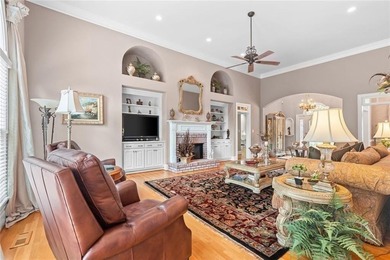 This exquisite four-sided blush brick estate is the epitome of on Royal Lakes Golf and Country Club in Georgia - for sale on GolfHomes.com, golf home, golf lot