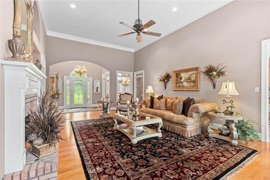 This exquisite four-sided blush brick estate is the epitome of on Royal Lakes Golf and Country Club in Georgia - for sale on GolfHomes.com, golf home, golf lot