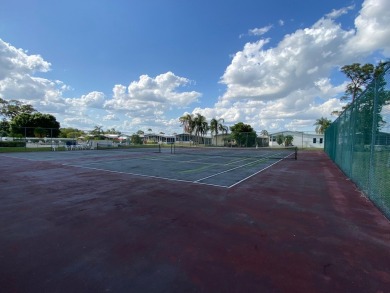 Discover the perfect blend of comfort and active living in this on Indianwood Golf and Country Club in Florida - for sale on GolfHomes.com, golf home, golf lot
