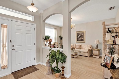 Welcome to a life that feels like vacation every day. Nestled in on Arlington Ridge Golf Club in Florida - for sale on GolfHomes.com, golf home, golf lot