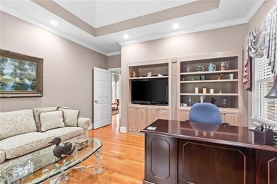 This exquisite four-sided blush brick estate is the epitome of on Royal Lakes Golf and Country Club in Georgia - for sale on GolfHomes.com, golf home, golf lot