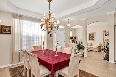 Welcome to a life that feels like vacation every day. Nestled in on Arlington Ridge Golf Club in Florida - for sale on GolfHomes.com, golf home, golf lot