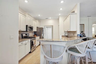 Welcome to a life that feels like vacation every day. Nestled in on Arlington Ridge Golf Club in Florida - for sale on GolfHomes.com, golf home, golf lot