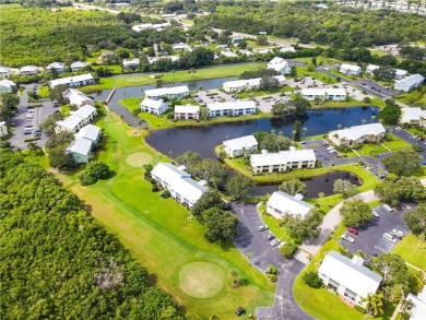 First floor unit with a lake view. 42* kitchen cabinets, granite on Pelican Pointe 9 Hole Course in Florida - for sale on GolfHomes.com, golf home, golf lot