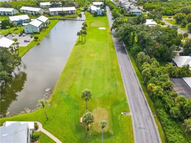 First floor unit with a lake view. 42* kitchen cabinets, granite on Pelican Pointe 9 Hole Course in Florida - for sale on GolfHomes.com, golf home, golf lot