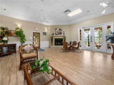 First floor unit with a lake view. 42* kitchen cabinets, granite on Pelican Pointe 9 Hole Course in Florida - for sale on GolfHomes.com, golf home, golf lot